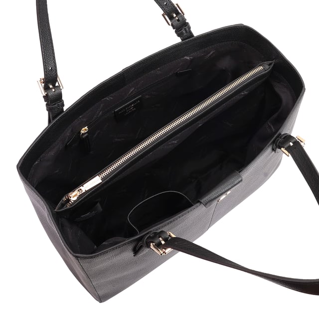 Discover the elegance of the Paul Costelloe Argo Leather Work Tote, meticulously handcrafted from premium soft leather. This spacious tote is designed for the modern professional, offering ample room for all your essentials while maintaining a structured silhouette. Features include a double top handle for comfortable carrying, a divided double compartment with a secure zip pocket, and convenient inside pockets for your mobile and cards. Elevate your work style with this stunning and functional bag that combines luxury with practicality.