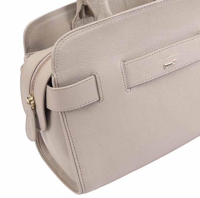 Discover the exquisite Colima Bag from Paul Costelloe, designed with a generous silhouette that ensures ample space for all your essentials and more. This stylish handbag features top handles for easy carrying, a large main compartment for your belongings, an internal zipped pocket for added security, and a neat pocket for quick access to smaller items. Elevate your wardrobe with this chic accessory, perfect for any outfit and an essential addition to your collection.