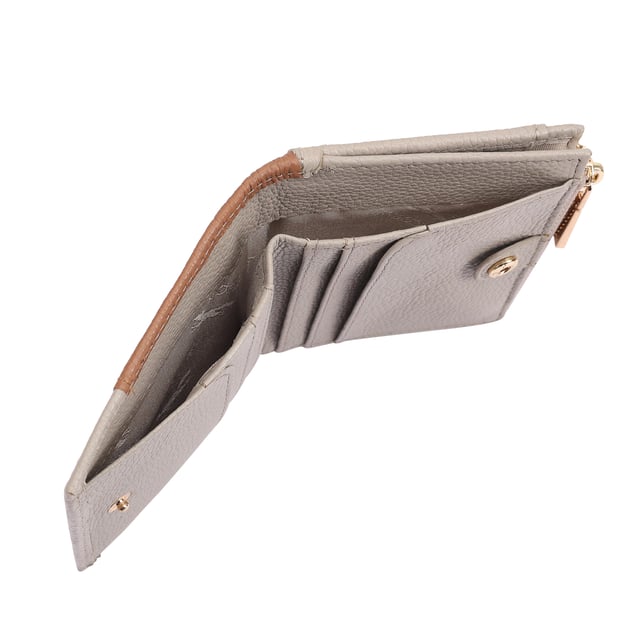 Discover the Tilly Card and Coin Purse, a perfect blend of style and functionality. This sleek accessory is designed to keep your cards and coins organized with ease. Featuring an exterior display section, you can quickly access your most-used bank or travel cards while on the go. Adorned with an iconic fox logo, this purse adds a sophisticated touch to your daily essentials, making it not just practical but also a fashionable statement. Upgrade your accessory game with the Tilly Purse today!