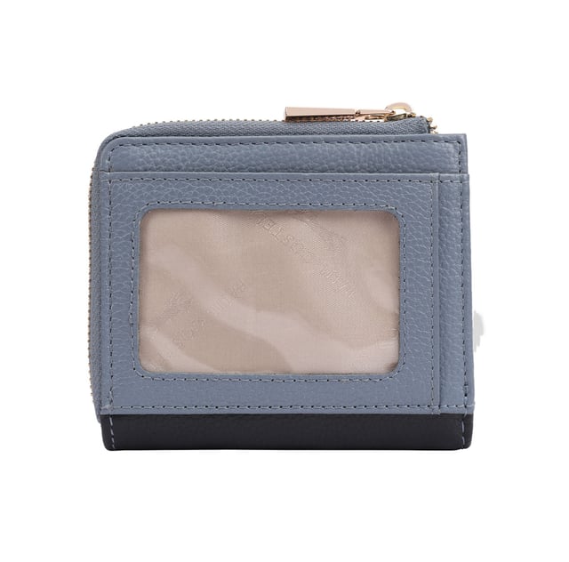 Discover the Tilly Card and Coin Purse, a perfect blend of style and functionality. This sleek accessory is designed to keep your cards and coins organized with ease. Featuring an exterior display section, you can quickly access your most-used bank or travel cards while on the go. Adorned with an iconic fox logo, this purse adds a sophisticated touch to your daily essentials, making it not just practical but also a fashionable statement. Upgrade your accessory game with the Tilly Purse today!