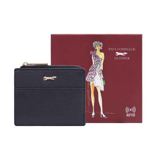 Discover the Tilly Card and Coin Purse, a sleek and practical accessory designed to keep your essentials organized in style. This purse features an exterior display section, allowing you to easily access your most-used bank or travel cards while on the go. The iconic fox logo adds a touch of sophistication, making it a must-have for anyone who values both form and function. Perfect for everyday use or travel, the Tilly purse is an essential companion for your busy lifestyle.
