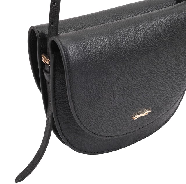 Discover the Hades Half-Moon Crossbody Bag, a perfect blend of elegance and functionality. This chic bag features stylish double flaps that enhance its sophisticated design, while the sleek silhouette is beautifully complemented by a refined metal logo at the front. With an adjustable shoulder strap, this bag offers comfort and convenience, making it an ideal accessory for any occasion. Elevate your outfit with this versatile crossbody bag that effortlessly combines style and practicality.