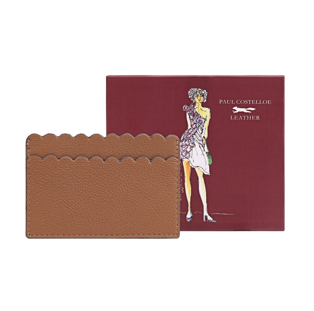 Discover the exquisite Mellah Card Holder, expertly crafted from soft genuine leather. This stylish accessory features intricate scallop detailing, adding a touch of elegance to your everyday essentials. Perfectly designed to hold your travel or bank cards, it combines practicality with luxury. Each card holder comes beautifully packaged in a gift box, making it an ideal gift for yourself or a loved one. Elevate your accessory collection with the Mellah Card Holder, a must-have for those who appreciate fine craftsmanship and timeless style.