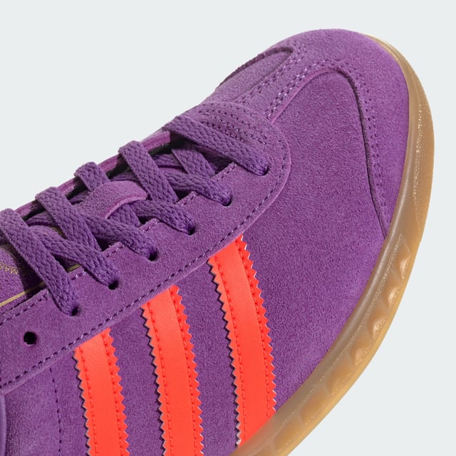 Hamburg Shoes A classic reborn. Originally released in 1982, the adidas Hamburg Shoes were visionary trainers in their day. Nowadays, they're ready to forge new paths and set trends on the streetwear scene. Crafted from premium leather with a double-stitched T-toe and contrast heel tab and 3-Stripes, they reinvent retro cool for the modern day. The low-profile rubber outsole with moulded sidewalls and honeycomb traction keeps you stable and your stride steady over the sidewalks and streets of your city. The Hamburg's blend of sporty style and everyday versatility has made them an adidas Originals favourite for over 40 years. Match them with jeans, wide-leg capris or a cute skirt to ground your fashion in authentic adidas heritage. - Regular fit - Lace closure - Leather upper - Synthetic lining - Rubber outsole Shipped by adidas
