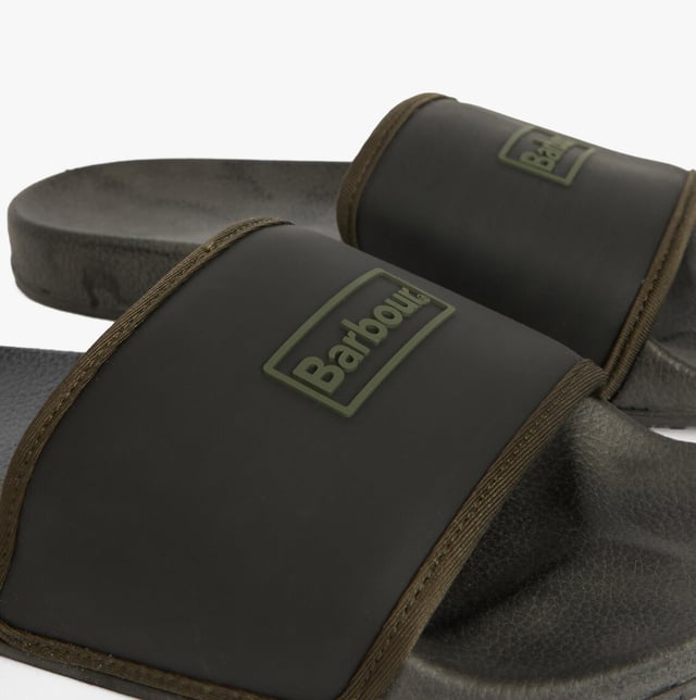 These men's sliders feature a polyurethane upper, neoprene lining, and rubber sole for lightweight comfort. Ideal for casual wear, they are slip-on and easy to clean