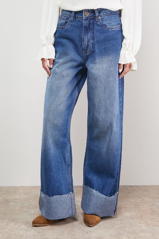 Distinctive turnup hem detail creates a contemporary silhouette
        Straight leg design offers a relaxed, comfortable fit
        High-rise waistband for a flattering shape
        Classic five-pocket styling with traditional stitching
        Wide leg opening with substantial cuff detail for a fashion-forward look
    
    These Oasis denim straight leg jeans combine timeless style with modern detailing. The relaxed fit and statement turnup hem create a fresh, contemporary look that's perfect for everyday wear. Style with a simple white tee and tan accessories for an effortlessly chic daytime ensemble, or pair with a floral blouse and ballet flats for weekend brunches and casual gatherings. The versatile straight leg silhouette works beautifully with both fitted and oversized tops, making these jeans a true wardrobe staple. For cooler days, layer with an oversized cardigan or denim jacket and trainers for a casual yet put-together look. The high-rise waist and relaxed fit through the leg ensure all-day comfort without compromising on style.
