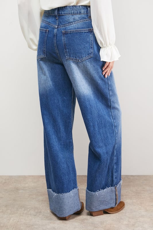 Distinctive turnup hem detail creates a contemporary silhouette
        Straight leg design offers a relaxed, comfortable fit
        High-rise waistband for a flattering shape
        Classic five-pocket styling with traditional stitching
        Wide leg opening with substantial cuff detail for a fashion-forward look
    
    These Oasis denim straight leg jeans combine timeless style with modern detailing. The relaxed fit and statement turnup hem create a fresh, contemporary look that's perfect for everyday wear. Style with a simple white tee and tan accessories for an effortlessly chic daytime ensemble, or pair with a floral blouse and ballet flats for weekend brunches and casual gatherings. The versatile straight leg silhouette works beautifully with both fitted and oversized tops, making these jeans a true wardrobe staple. For cooler days, layer with an oversized cardigan or denim jacket and trainers for a casual yet put-together look. The high-rise waist and relaxed fit through the leg ensure all-day comfort without compromising on style.