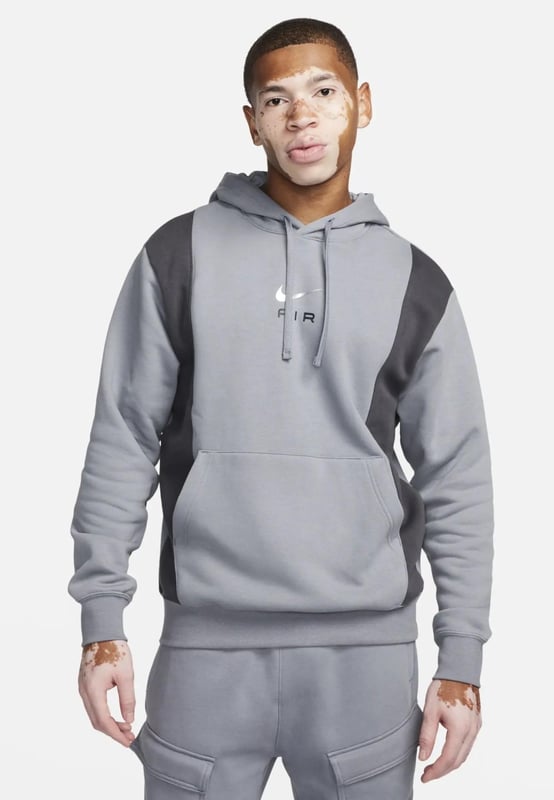 Nike Mens Panel Hoodie. - -. Standard Fit Hoodie Features a Classic Overhead Design. - -. Made From a Soft and Breathable Cotton-poly Fleece Fabric. - - . Features an Adjustable Hood for Custom Coverage. - - . Ribbed Cuffs to Hold the Shape. - - . Featuring a Kangaroo Pocket for Storage. - - . Nike Air Logo on the Chest.