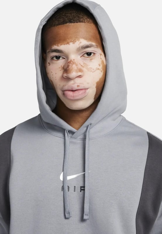 Nike Mens Panel Hoodie. - -. Standard Fit Hoodie Features a Classic Overhead Design. - -. Made From a Soft and Breathable Cotton-poly Fleece Fabric. - - . Features an Adjustable Hood for Custom Coverage. - - . Ribbed Cuffs to Hold the Shape. - - . Featuring a Kangaroo Pocket for Storage. - - . Nike Air Logo on the Chest.