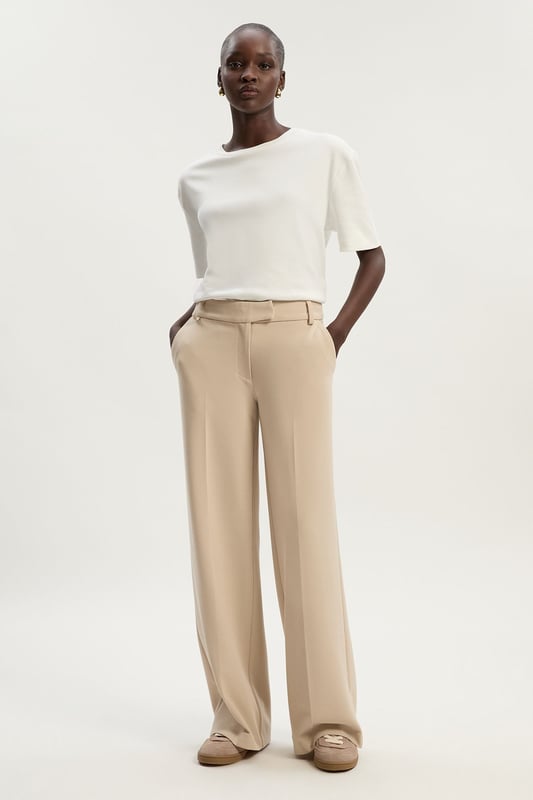 A capsule wardrobe piece that can be styled multiple ways, these trousers are cut in a modern straight leg design that hangs to the ankles with classic belt loops for practicality. Pair this piece with a matching blazer for a sleek workwear ensemble that can go from desk to dinner.Straight legBelt loopsTailored Browse this seasons suits now.