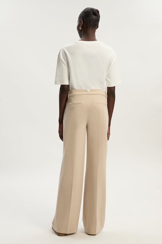 A capsule wardrobe piece that can be styled multiple ways, these trousers are cut in a modern straight leg design that hangs to the ankles with classic belt loops for practicality. Pair this piece with a matching blazer for a sleek workwear ensemble that can go from desk to dinner.Straight legBelt loopsTailored Browse this seasons suits now.