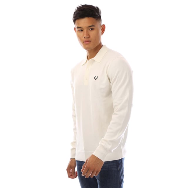 Mens Fred Perry Classic Knitted Shirt in white.- Ribbed collar.- Long sleeves with ribbed cuffs.- Three button placket.- Embroidered branding.- Ribbed hem.- 52% Wool  48% Cotton.- Ref: K4535129