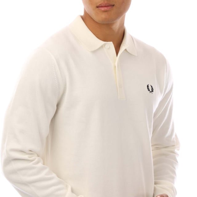 Mens Fred Perry Classic Knitted Shirt in white.- Ribbed collar.- Long sleeves with ribbed cuffs.- Three button placket.- Embroidered branding.- Ribbed hem.- 52% Wool  48% Cotton.- Ref: K4535129