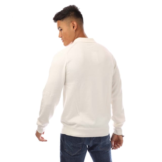 Mens Fred Perry Classic Knitted Shirt in white.- Ribbed collar.- Long sleeves with ribbed cuffs.- Three button placket.- Embroidered branding.- Ribbed hem.- 52% Wool  48% Cotton.- Ref: K4535129