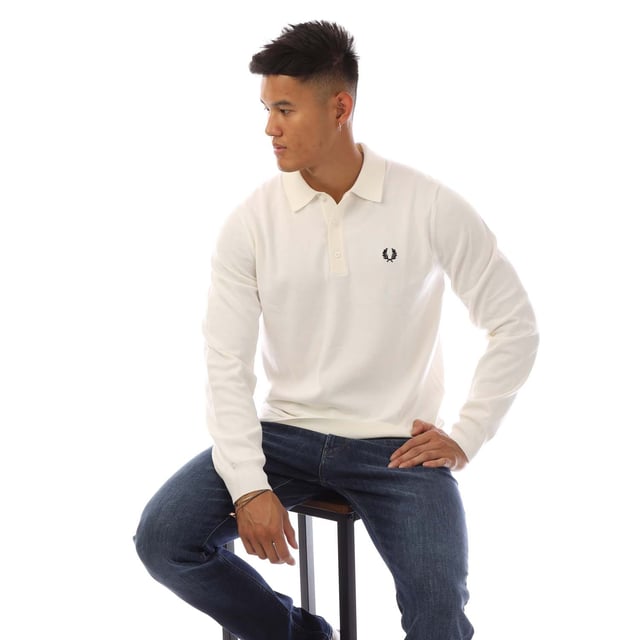 Mens Fred Perry Classic Knitted Shirt in white.- Ribbed collar.- Long sleeves with ribbed cuffs.- Three button placket.- Embroidered branding.- Ribbed hem.- 52% Wool  48% Cotton.- Ref: K4535129