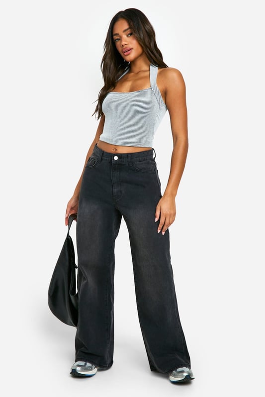 Ribbed jersey fabric for a comfortable, form-fitting look
        Halterneck design with a trendy crop length
        Sleeveless style perfect for warmer days
        Versatile piece that can be dressed up or down
        Figure-hugging silhouette to accentuate your curves
    
    This ribbed neckholder crop top is a must-have addition to your casual wardrobe. The halterneck design adds a touch of allure, while the cropped length allows you to show off just the right amount of skin. Perfect for those laid-back summer days or casual outings with friends, this top can be effortlessly styled for various occasions. Pair it with high-waisted wide-leg trousers and trainers for a relaxed daytime look, or dress it up with a midi skirt and strappy sandals for an evening out. The ribbed jersey fabric ensures a snug fit that moves with you, making it ideal for family gatherings or casual events where comfort is key. Layer it under a denim jacket or an oversized blazer when the temperature drops, proving its versatility as a year-round staple in your fashion arsenal.