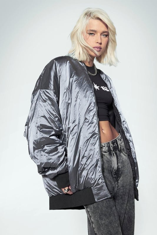 Keep things casual but always on-trend with a piece of outerwear perfection, the bomber jacket. A light jacket featuring a gathered, ribbed waistband and matching cuffs, a bomber jacket is versatile, timeless, and the perfect way to edge up your casual wear. Wear your new women's bomber jacket with a shirt and stripe joggers for the hottest look of the moment: sports luxe, or layer a varsity jacket over a t shirt dress for a fresh new-season look.Style: Bomber JacketLength: RegularSleeve Length: Long Sleeve
