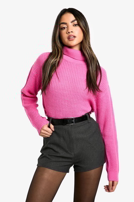 Cosy roll neck design for ultimate comfort
        Ribbed knit texture adds visual interest
        Cropped length for a modern silhouette
        Relaxed fit through the body for easy layering
        Versatile style suitable for various casual occasions
    
    This short basic roll neck jumper is a must-have addition to your casual wardrobe. The ribbed knit texture not only adds a touch of visual intrigue but also ensures warmth during cooler days. Its cropped length makes it perfect for pairing with high-waisted bottoms, creating a balanced and contemporary look. As seen on the model, try styling it with tailored shorts and sheer tights for an edgy twist on casual wear. For a more laid-back ensemble, pair it with your favourite jeans and trainers. The relaxed fit allows for easy layering, making it ideal for family gatherings or casual outings with friends. Whether you're heading to a coffee shop or a casual dinner, this jumper offers both style and comfort, embodying the Boohoo ethos of accessible fashion for the trend-conscious young woman.