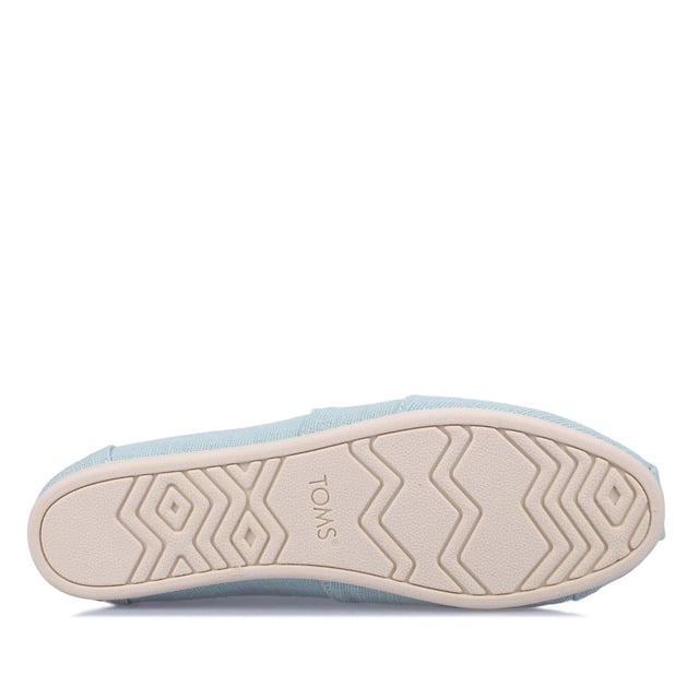 Textiel bovenwerk canvas voetbed TOMS signature CloudBound zolen voor extra comfort ademend vermogen en tractie uitneembaar en handwasbaar. OrthoLite Eco LT hybride inlegzool voor lichtgewicht demping gemaakt van plantaardige en gerecyclede materialen. Elastische gore voor makkelijke pasvorm