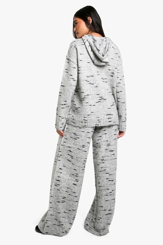 Wide-leg knit trousers for ultimate comfort
        Textured fabric with a unique speckled pattern
        High-waisted design for a flattering silhouette
        Relaxed fit through the legs for easy movement
        Versatile style suitable for various casual occasions
    
    Embrace laid-back chic with these wide-leg knit trousers from Boohoo. The textured fabric features an eye-catching speckled pattern, adding visual interest to your casual ensemble. The high-waisted design creates a sleek silhouette, while the relaxed fit through the legs ensures all-day comfort. Perfect for lazy weekends or casual outings, these trousers can be effortlessly styled with a cropped hoodie and trainers for a trendy look. For a more put-together appearance, pair them with a fitted turtleneck and ankle boots. The versatility of these trousers makes them a must-have addition to your wardrobe, suitable for family gatherings, coffee dates with friends, or simply lounging at home in style. Customise your look by rolling up the hems or leaving them long to create different vibes for various occasions.