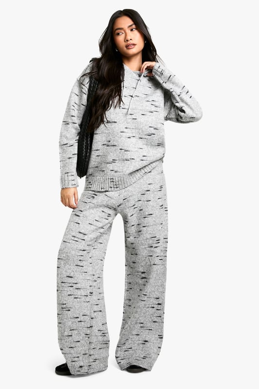 Wide-leg knit trousers for ultimate comfort
        Textured fabric with a unique speckled pattern
        High-waisted design for a flattering silhouette
        Relaxed fit through the legs for easy movement
        Versatile style suitable for various casual occasions
    
    Embrace laid-back chic with these wide-leg knit trousers from Boohoo. The textured fabric features an eye-catching speckled pattern, adding visual interest to your casual ensemble. The high-waisted design creates a sleek silhouette, while the relaxed fit through the legs ensures all-day comfort. Perfect for lazy weekends or casual outings, these trousers can be effortlessly styled with a cropped hoodie and trainers for a trendy look. For a more put-together appearance, pair them with a fitted turtleneck and ankle boots. The versatility of these trousers makes them a must-have addition to your wardrobe, suitable for family gatherings, coffee dates with friends, or simply lounging at home in style. Customise your look by rolling up the hems or leaving them long to create different vibes for various occasions.