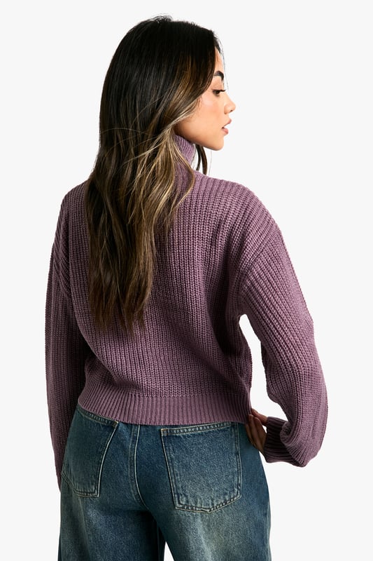 Cropped length for a trendy silhouette
        Ribbed knit texture for added visual interest
        Relaxed fit through the body for comfort
        Roll neck design for warmth and style
        Versatile piece for layering or wearing alone
    
    This short roll neck jumper from Boohoo is the perfect addition to your casual wardrobe. The cropped length and relaxed fit create a contemporary silhouette that's both comfortable and stylish. Pair it with high-waisted wide-leg jeans and trainers for a laid-back weekend look, or dress it up with a midi skirt and ankle boots for a casual night out. The ribbed texture adds a touch of visual interest, while the roll neck keeps you cosy on chilly days. Layer it under a oversized blazer for a smart-casual ensemble, or wear it on its own with your favourite denim for effortless style. This versatile piece is ideal for family gatherings, coffee dates with friends, or casual Fridays at the office. Its simplicity makes it easy to customise with accessories, allowing you to create multiple looks with just one garment.