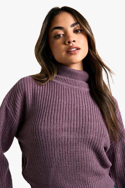 Cropped length for a trendy silhouette
        Ribbed knit texture for added visual interest
        Relaxed fit through the body for comfort
        Roll neck design for warmth and style
        Versatile piece for layering or wearing alone
    
    This short roll neck jumper from Boohoo is the perfect addition to your casual wardrobe. The cropped length and relaxed fit create a contemporary silhouette that's both comfortable and stylish. Pair it with high-waisted wide-leg jeans and trainers for a laid-back weekend look, or dress it up with a midi skirt and ankle boots for a casual night out. The ribbed texture adds a touch of visual interest, while the roll neck keeps you cosy on chilly days. Layer it under a oversized blazer for a smart-casual ensemble, or wear it on its own with your favourite denim for effortless style. This versatile piece is ideal for family gatherings, coffee dates with friends, or casual Fridays at the office. Its simplicity makes it easy to customise with accessories, allowing you to create multiple looks with just one garment.