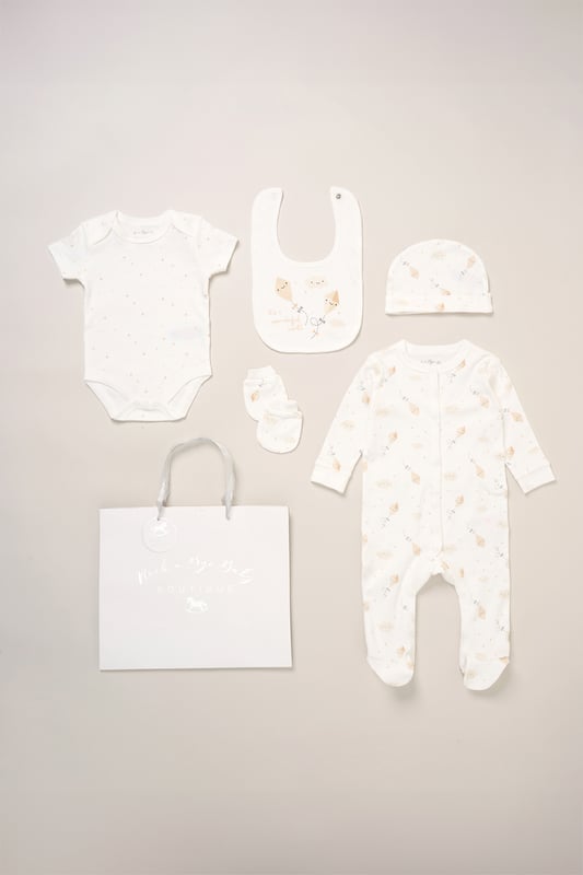 Surprise new parents with the printed 5-Piece baby gift Set from Rock A Bye Baby Boutique. This thoughtful bundle includes a cosy matching all-in-one, bodysuit, bib, hat, and mitts for essential wardrobe pieces. Crafted from 100% cotton, each item ensures their baby stays stylish and snug, perfect for everyday wear or special occasions. Packaged elegantly in a mesh bag.