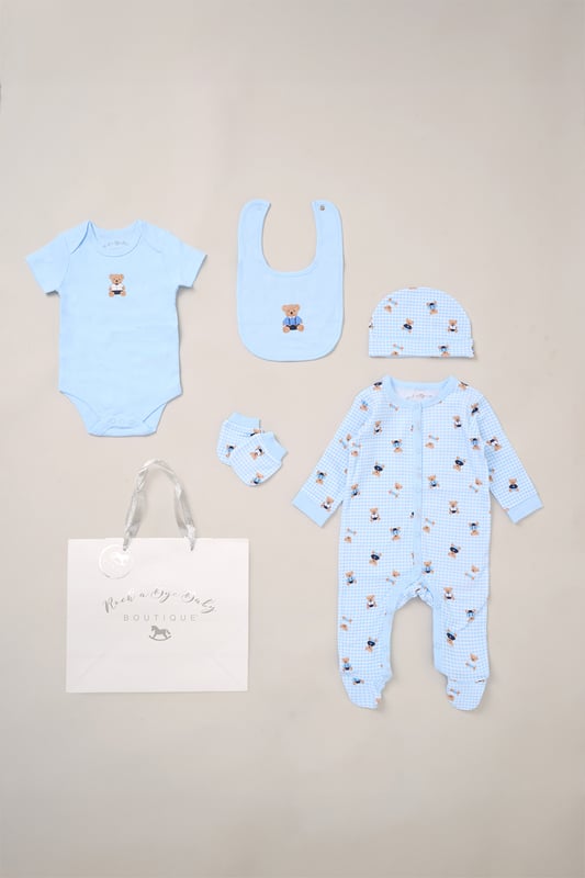 Surprise new parents with the printed 5-Piece baby gift Set from Rock A Bye Baby Boutique. This thoughtful bundle includes a cosy matching all-in-one, bodysuit, bib, hat, and mitts for essential wardrobe pieces. Crafted from 100% cotton, each item ensures their baby stays stylish and snug, perfect for everyday wear or special occasions. Packaged elegantly in a mesh bag.