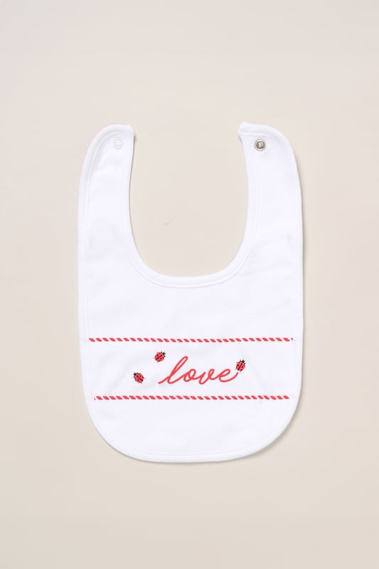 Surprise new parents with this adorable love heart printed five-Piece Hanging Gift Set from Lily and Jack. This thoughtful bundle features an all-over illustrated print, including a cosy all-in-one, coordinating bodysuit, bib, hat, and mitts. Crafted with care for style and comfort, each item ensures their baby stays snug and stylish for everyday wear or special occasions. Packaged elegantly in a mesh bag, it's the perfect way to celebrate the newest addition to their family.