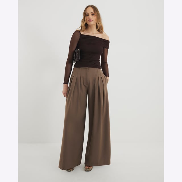 River Island Womens Brown Asymmetric Neck Ruched Mesh Top Asymmetric neckline, Ruched detail, Mesh detail, Long sleevedAbout the brandFASHION IS OUR DNARiver Island is an icon of the British high street. Inspired by the latest trends and our heritage style archives, we've been serving style and leading trends for over sixty years.We make fashion for real people with real lives, who want to look real good. Because life's a celebration - let's dress for it.