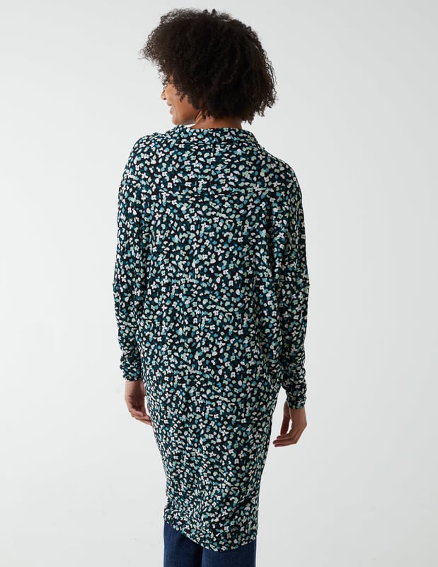 Find your comfort zone with the Draped Dip Hem Top. With its mid length and high neck, match this top with black skinny jeans and high knee boots for the perfect look when going on a city break. 