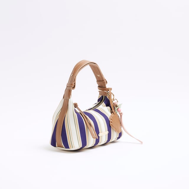 River Island Womens Blue Canvas Striped Charm Shoulder Bag Canvas fabric, Striped print, Charm detail, Metal gold RI hardware, Grab handles, Adjustable strap, Zip fastening, Strap length: 14cm, Bag dimensions H: 13cm x D: 26cm x W: 12cmAbout the brandFASHION IS OUR DNARiver Island is an icon of the British high street. Inspired by the latest trends and our heritage style archives, we've been serving style and leading trends for over sixty years.We make fashion for real people with real lives, who want to look real good. Because life's a celebration - let's dress for it.