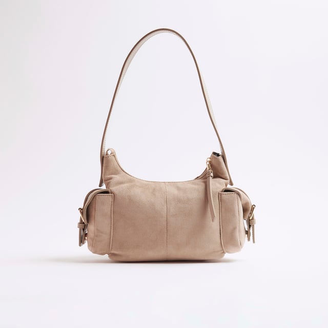 River Island Womens Beige Faux Suede Buckle Pocket Utility Bag Shoulder strap, Buckle pockets, Embossed branding, Zipped fastening, W 23cm x D 8cmAbout the brandFASHION IS OUR DNARiver Island is an icon of the British high street. Inspired by the latest trends and our heritage style archives, we've been serving style and leading trends for over sixty years.We make fashion for real people with real lives, who want to look real good. Because life's a celebration - let's dress for it.
