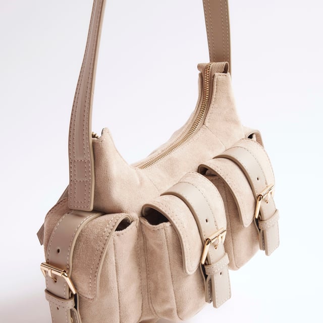 River Island Womens Beige Faux Suede Buckle Pocket Utility Bag Shoulder strap, Buckle pockets, Embossed branding, Zipped fastening, W 23cm x D 8cmAbout the brandFASHION IS OUR DNARiver Island is an icon of the British high street. Inspired by the latest trends and our heritage style archives, we've been serving style and leading trends for over sixty years.We make fashion for real people with real lives, who want to look real good. Because life's a celebration - let's dress for it.
