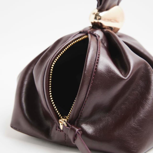Faux leather, Grab handle, Gold detail, Zip fastening, Dimensions: L: 16cm x D: 14cm x W: 28cmAbout the brandFASHION IS OUR DNARiver Island is an icon of the British high street. Inspired by the latest trends and our heritage style archives, we've been serving style and leading trends for over sixty years.We make fashion for real people with real lives, who want to look real good. Because life's a celebration - let's dress for it.