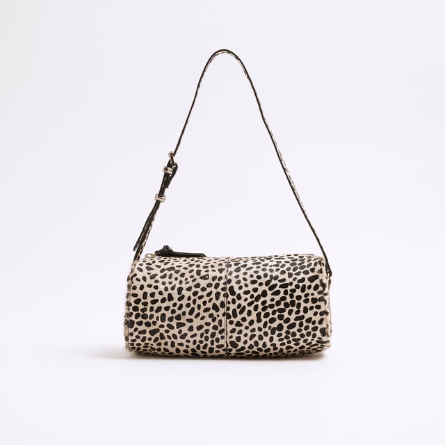 River Island Womens Cream Leather Animal Print Shoulder Bag Animal print, Leather, Fluffy texture, Adjustable shoulder strap, Zip fastening, Handle drop: 26cm, H: 13.5cm x W: 24cm x D: 11cmAbout the brandFASHION IS OUR DNARiver Island is an icon of the British high street. Inspired by the latest trends and our heritage style archives, we've been serving style and leading trends for over sixty years.We make fashion for real people with real lives, who want to look real good. Because life's a celebration - let's dress for it.