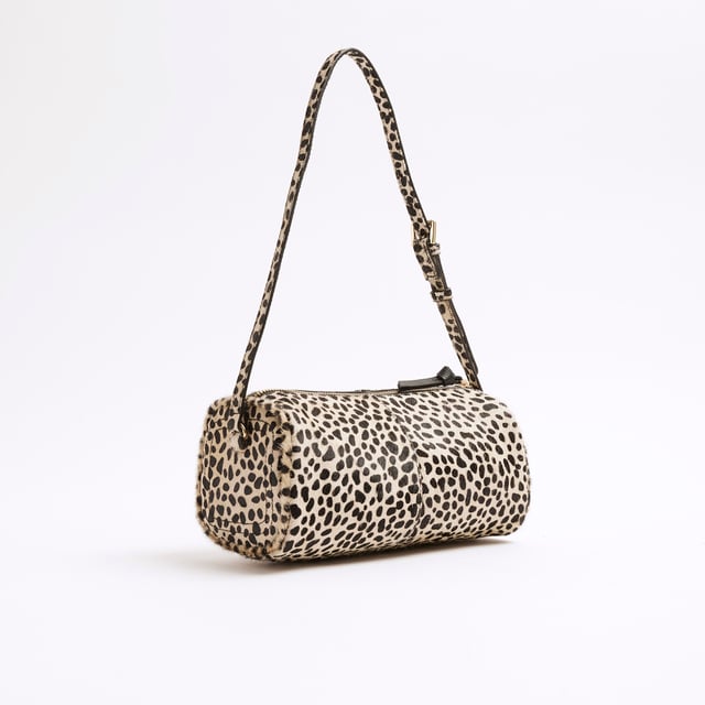 River Island Womens Cream Leather Animal Print Shoulder Bag Animal print, Leather, Fluffy texture, Adjustable shoulder strap, Zip fastening, Handle drop: 26cm, H: 13.5cm x W: 24cm x D: 11cmAbout the brandFASHION IS OUR DNARiver Island is an icon of the British high street. Inspired by the latest trends and our heritage style archives, we've been serving style and leading trends for over sixty years.We make fashion for real people with real lives, who want to look real good. Because life's a celebration - let's dress for it.
