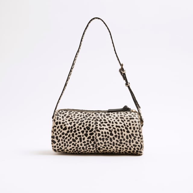 River Island Womens Cream Leather Animal Print Shoulder Bag Animal print, Leather, Fluffy texture, Adjustable shoulder strap, Zip fastening, Handle drop: 26cm, H: 13.5cm x W: 24cm x D: 11cmAbout the brandFASHION IS OUR DNARiver Island is an icon of the British high street. Inspired by the latest trends and our heritage style archives, we've been serving style and leading trends for over sixty years.We make fashion for real people with real lives, who want to look real good. Because life's a celebration - let's dress for it.