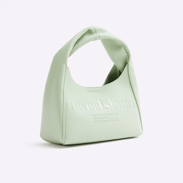 River Island Womens Green Faux Leather Debossed Ri Scoop Bag Faux leather, Debossed detail, RI branding, Handle length: 14cm, Bag dimensions: L: 18cm x D: 11cm x W: 22.5cmAbout the brandFASHION IS OUR DNARiver Island is an icon of the British high street. Inspired by the latest trends and our heritage style archives, we've been serving style and leading trends for over sixty years.We make fashion for real people with real lives, who want to look real good. Because life's a celebration - let's dress for it.