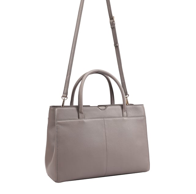 Made from soft premium leather, MAHAVY is a stylish work/travel bag is designed for both function and flair. It features two main compartments with a central zip section, all secured by a sleek magnetic tab. Inside, zipped and slip pockets on either side offer organized storageyou're your smaller essentials like keys, coin and phone. Complete with a removable, adjustable shoulder strap, it's a versatile and trendy companion for everyday use or travel. D:14.3cm W:33cm H:23.5cm