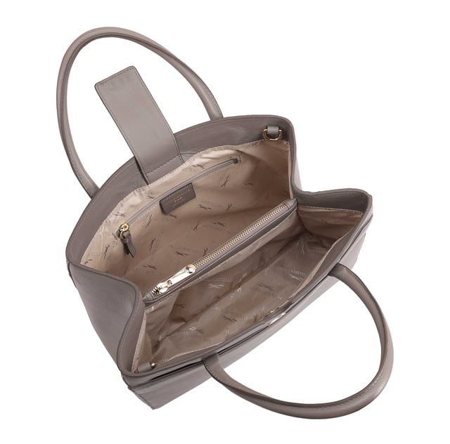 Made from soft premium leather, MAHAVY is a stylish work/travel bag is designed for both function and flair. It features two main compartments with a central zip section, all secured by a sleek magnetic tab. Inside, zipped and slip pockets on either side offer organized storageyou're your smaller essentials like keys, coin and phone. Complete with a removable, adjustable shoulder strap, it's a versatile and trendy companion for everyday use or travel. D:14.3cm W:33cm H:23.5cm
