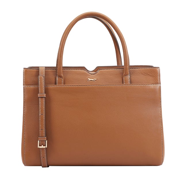 Made from soft premium leather, MAHAVY is a stylish work/travel bag is designed for both function and flair. It features two main compartments with a central zip section, all secured by a sleek magnetic tab. Inside, zipped and slip pockets on either side offer organized storageyou're your smaller essentials like keys, coin and phone. Complete with a removable, adjustable shoulder strap, it's a versatile and trendy companion for everyday use or travel. D:14.3cm W:33cm H:23.5cm