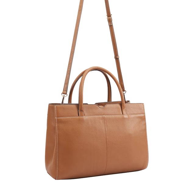 Made from soft premium leather, MAHAVY is a stylish work/travel bag is designed for both function and flair. It features two main compartments with a central zip section, all secured by a sleek magnetic tab. Inside, zipped and slip pockets on either side offer organized storageyou're your smaller essentials like keys, coin and phone. Complete with a removable, adjustable shoulder strap, it's a versatile and trendy companion for everyday use or travel. D:14.3cm W:33cm H:23.5cm