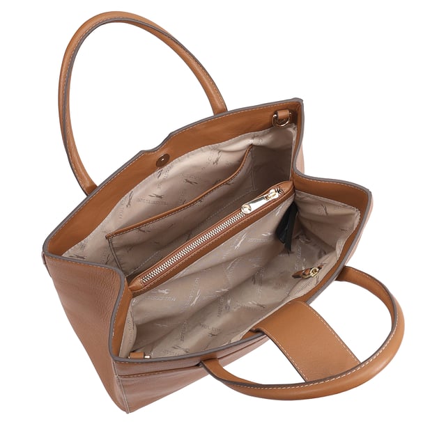 Made from soft premium leather, MAHAVY is a stylish work/travel bag is designed for both function and flair. It features two main compartments with a central zip section, all secured by a sleek magnetic tab. Inside, zipped and slip pockets on either side offer organized storageyou're your smaller essentials like keys, coin and phone. Complete with a removable, adjustable shoulder strap, it's a versatile and trendy companion for everyday use or travel. D:14.3cm W:33cm H:23.5cm