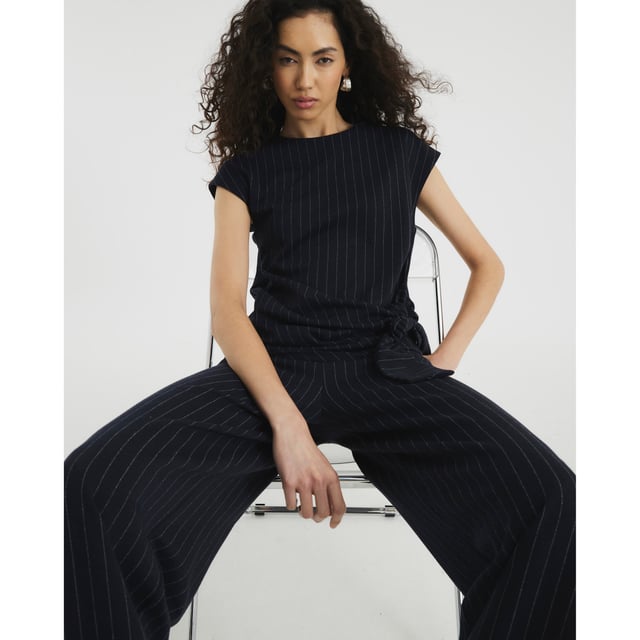 River Island Womens Navy Short Sleeve Pinstripe Tie Detail Top Crew neckline, Pinstripe, Short sleeves, Tie detailAbout the brandFASHION IS OUR DNARiver Island is an icon of the British high street. Inspired by the latest trends and our heritage style archives, we've been serving style and leading trends for over sixty years.We make fashion for real people with real lives, who want to look real good. Because life's a celebration - let's dress for it.
