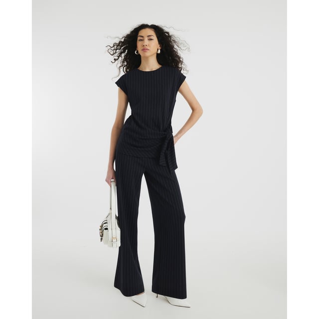 River Island Womens Navy Short Sleeve Pinstripe Tie Detail Top Crew neckline, Pinstripe, Short sleeves, Tie detailAbout the brandFASHION IS OUR DNARiver Island is an icon of the British high street. Inspired by the latest trends and our heritage style archives, we've been serving style and leading trends for over sixty years.We make fashion for real people with real lives, who want to look real good. Because life's a celebration - let's dress for it.