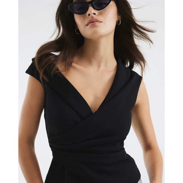 V-neck, Sleeveless, Lapels, Wrap design, Draped detail, Asymmetric hemAbout the brandFASHION IS OUR DNARiver Island is an icon of the British high street. Inspired by the latest trends and our heritage style archives, we've been serving style and leading trends for over sixty years.We make fashion for real people with real lives, who want to look real good. Because life's a celebration - let's dress for it.