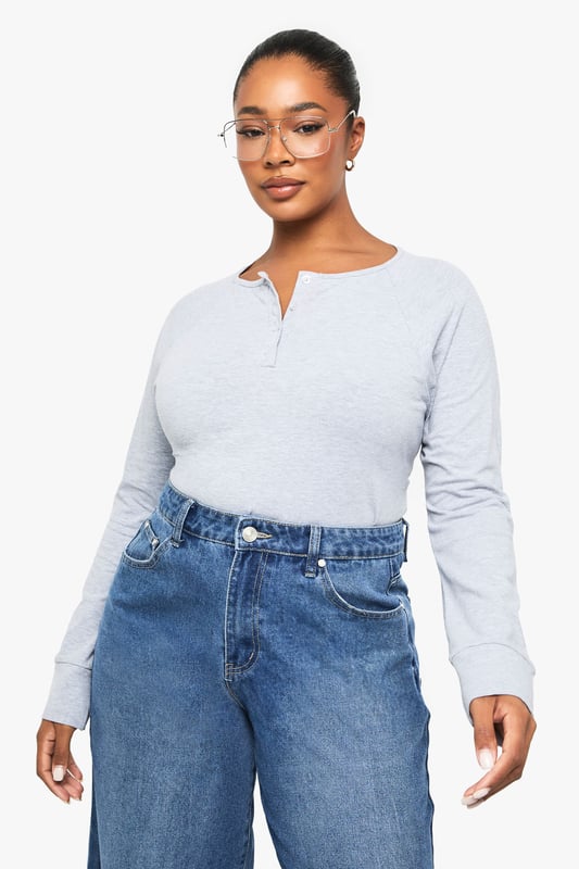 Soft jersey fabric with a relaxed, boxy silhouette for all-day comfort
        Classic Henley neckline with button placket detail adding a subtle stylish touch
        Long sleeves with neat cuffs perfect for transitional weather
        Versatile design that pairs effortlessly with jeans, trousers or skirts
        Inclusive plus sizing designed to flatter your curves with a comfortable fit
    
    This casual Henley top combines timeless style with everyday comfort. The boxy cut creates a relaxed silhouette that's perfect for your off-duty wardrobe, whilst the button placket adds just the right amount of interest to elevate it beyond a basic tee. Style it as seen with wide-leg denim for a contemporary casual look, or tuck the front into high-waisted trousers for a more defined shape. The versatile design makes it ideal for family gatherings, weekend brunches or casual Fridays at work. Layer under a denim jacket when the temperature drops or wear on its own with your favourite accessories. This Boohoo essential will quickly become your go-to for those days when you want to look put-together without sacrificing comfort.