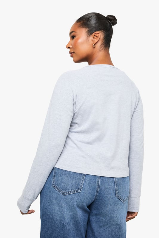 Soft jersey fabric with a relaxed, boxy silhouette for all-day comfort
        Classic Henley neckline with button placket detail adding a subtle stylish touch
        Long sleeves with neat cuffs perfect for transitional weather
        Versatile design that pairs effortlessly with jeans, trousers or skirts
        Inclusive plus sizing designed to flatter your curves with a comfortable fit
    
    This casual Henley top combines timeless style with everyday comfort. The boxy cut creates a relaxed silhouette that's perfect for your off-duty wardrobe, whilst the button placket adds just the right amount of interest to elevate it beyond a basic tee. Style it as seen with wide-leg denim for a contemporary casual look, or tuck the front into high-waisted trousers for a more defined shape. The versatile design makes it ideal for family gatherings, weekend brunches or casual Fridays at work. Layer under a denim jacket when the temperature drops or wear on its own with your favourite accessories. This Boohoo essential will quickly become your go-to for those days when you want to look put-together without sacrificing comfort.
